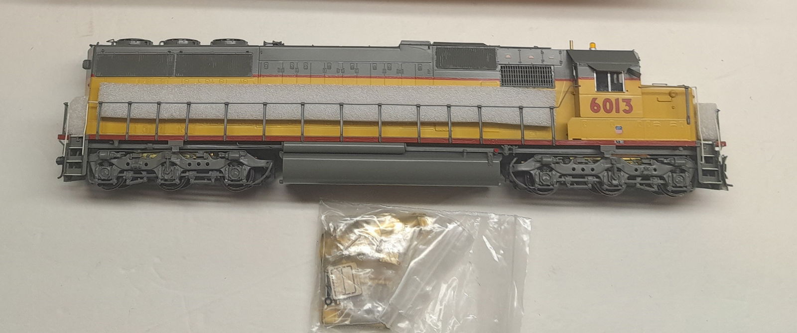 S Scale Brass - Overland SD-60 Locomotive c/p as UP 6013: S scale brass - Overland #1739 an EMD SD-60 custom, or is it factory painted as Union Pacific 6013. Never seen track. Clean model, box and foam are fine too. One end foam is missing so bubble wrap is