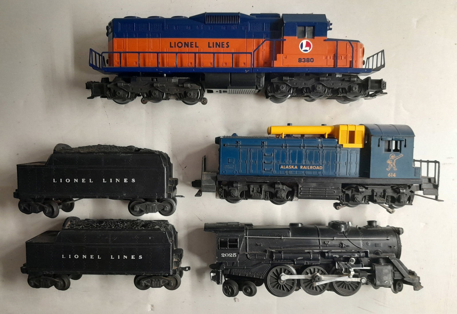 Lionel Locomotives: Diesels (2) + 2025 w. 6466Ws: Lionel locomotives: 614 diesel Alaska Railroad, 8380 Lionel, 2025 (2-6-4) with 2 whistle tenders.