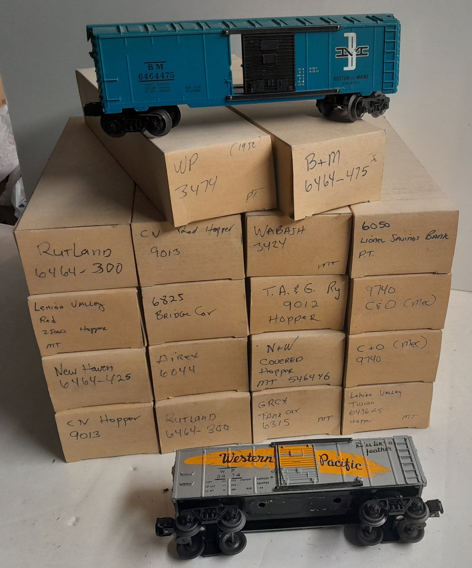 Lionel 18 re-Boxed Freight Cars: 18 Lionel freight cars, boxes have accurate part numbers. Most are clean.