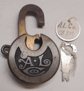 Alco Locomotive Works Brass Pancake Lock & Key: Brass pancake lock from the American Locomotive Company. Wonderful ALCo initials cast in relief. The key works fine.