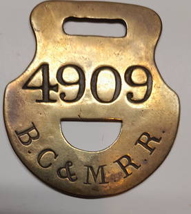 Boston Concord & Montreal Railroad Brass Baggage Tag: Boston Concord & Montreal Railroad (pre-1889) brass baggage tag with a 1/2 moon cut-out. The BC&M initials are in an arc, old John Robbins hallmark on reverse. Serial number is 4909. It measures