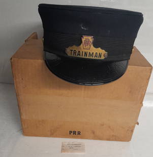 Pennsylvania Railroad Trainman Hat in Original Box: A Pennsylvania Railroad Trainman hat in original PRR stamped box. Tag says employee name and 7 3/8. Hat is 7 1/4.. Unusual to get the shipping box.