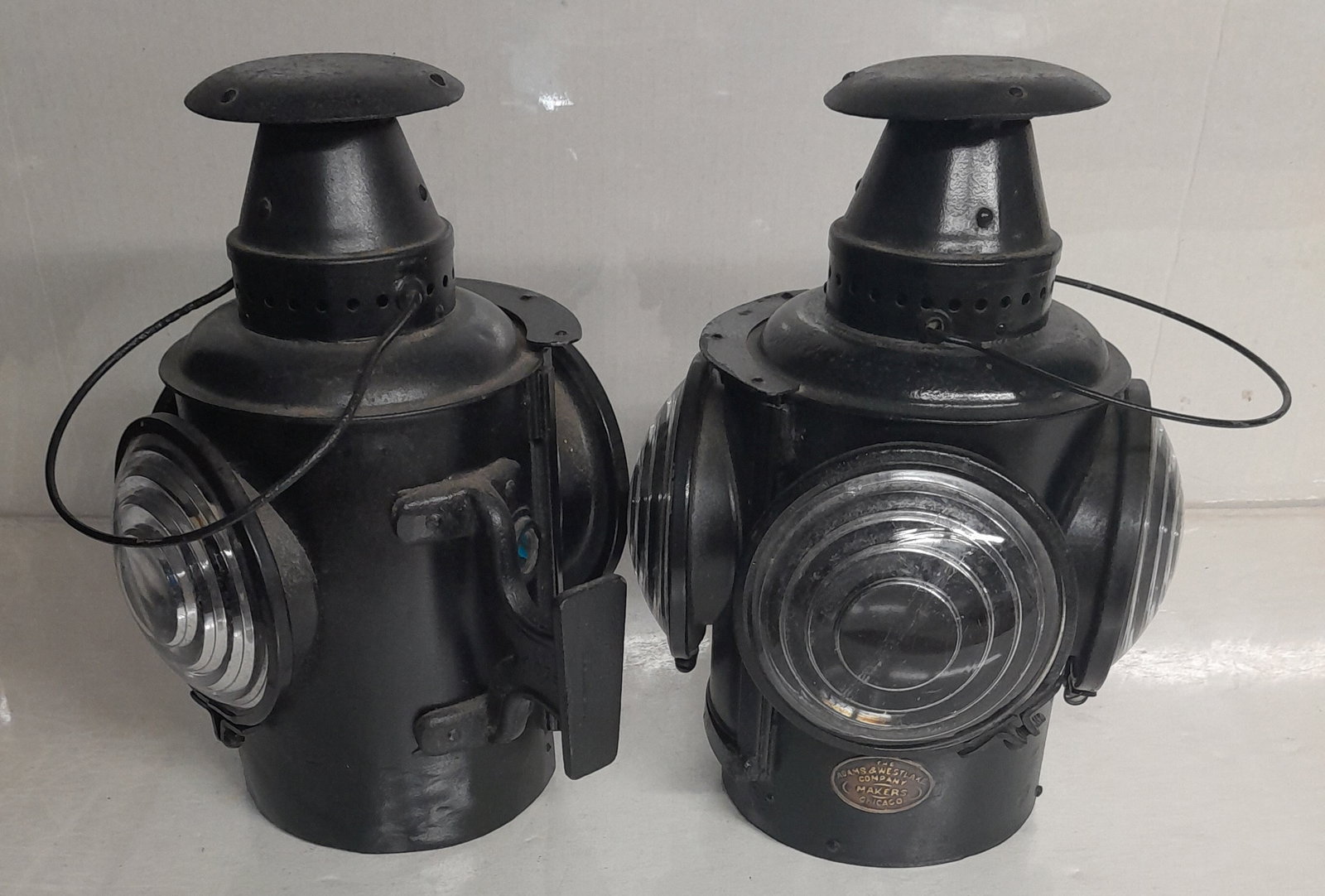 Classification Lamp Pair by Adams & Westlake 3 lens: Pair of Adams & Westlake class lamps. 3 lens, one is blue on one side. Old A&W oval brass tag on just one. No pots. Nice matched pair.