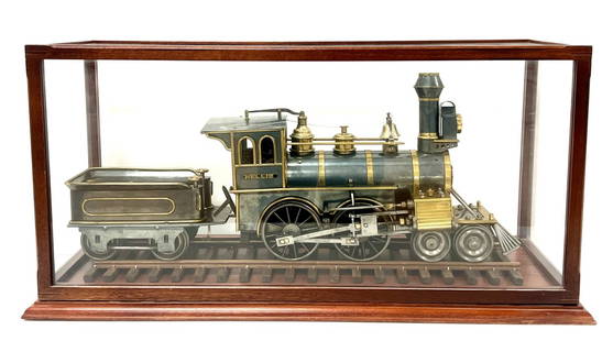 NELLIE - Live Steam Locomotive: Incredible, Early, Detailed Live Steam Loco and Tender. Documentation from Murray Dated 1876. Under wonderful Glass Display Case. Including some documents and Photos from 1940’s Live steam show. 26&