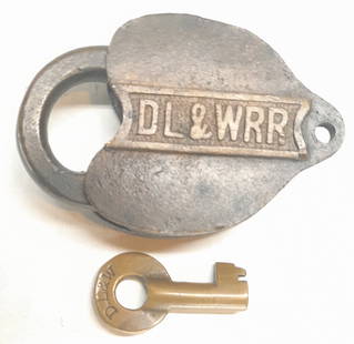 DL&W RR Cast Panel Brass Lock & Key: A Delaware Lackawanna & Western brass lock with the initials cast on the drop. Also has a key by Fraim with "T 10175".