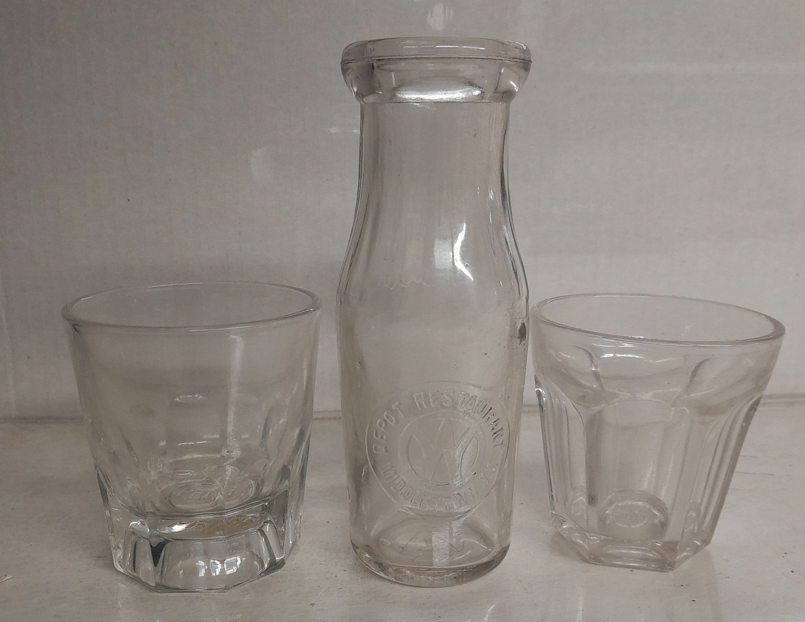 Railroad Glassware: NYO&W, Erie, PRR: 3 pieces of railroad glassware: New York Ontario & Western 1/2 pint milk/cream with Middletown Depot Restaurant, ERIE cast bottom glass, Pennsylvania Railroad PRR cast bottom glass. Cream bottle has d