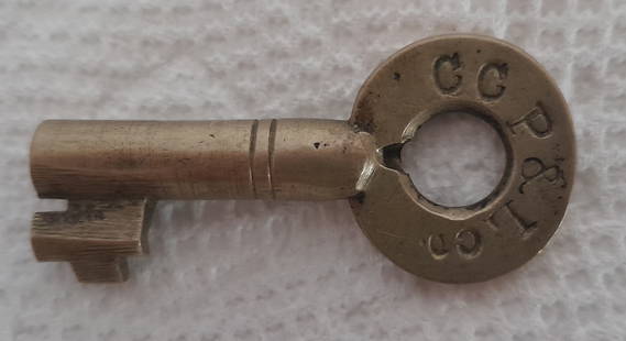 Cumberland County Power & Light Co. Switch Key - Maine: The Cumberland County Power & Light Company operated in the Portland Maine area. This was an electric line. The brass key was made by Climax. Nice markings.