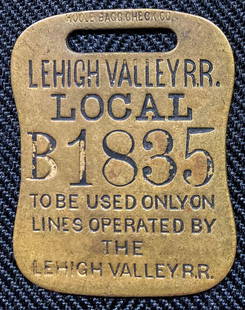 Lehigh Valley "Local" Brass Baggage Tag: A great tag that explicitly states that it can just be used on Lehigh Valley trains. This is exactly what "Local" means. It is serial number B1835 and it is single sided. It was made by Hoole Manufact