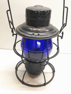 NYC RR Reliable Lantern Blue Etched NYC LINES Globe: An Adlake Reliable lantern frame with NYC RR stamped in the lid. The frame has been painted black. It has a later model Reliable pot & burner. The globe has cast Corning Cnx hallmark and a "5" cast ab