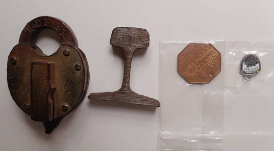 Edaville Railroad Memorabilia: Lock, Sterling Charm, Brass Token: Items from Edaville in Carver Massachusetts and a section of Sandy River & Rangeley Lakes rail. The lock has EDA RR and was made by Slaymaker in 1946. It looks loke if might take a Maine Central switc