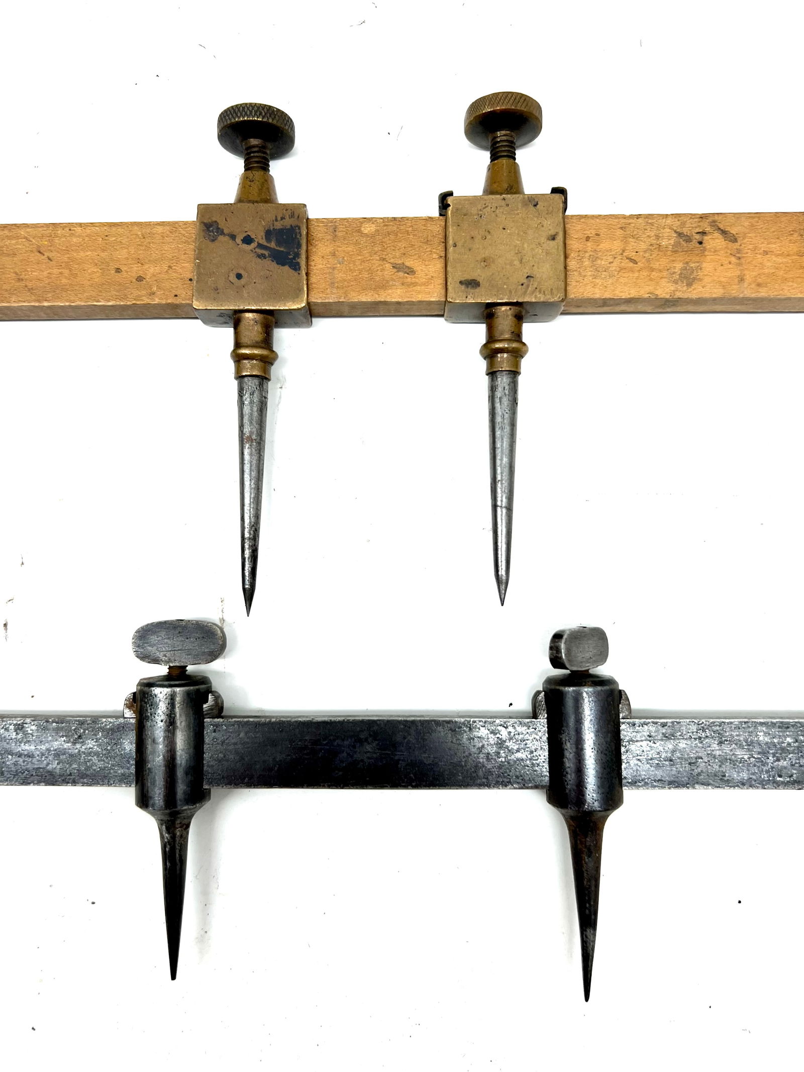 Pair of trammel points on beams (1 of 3)