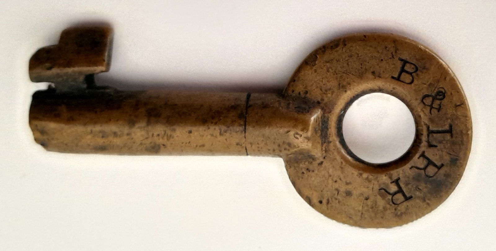 Boston & Lowell Railroad - Brass Switch Key by Bohannan: A brass switch key made by Bohannan for the Boston & Lowell Railroad. It's the standard B&L dog-leg switch bit. It's a single ring standard design Bohannan with an "S" for switch on the reverse. Lots