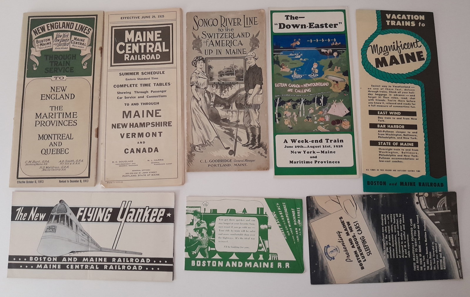 New England Railroad Travel Folders (8) B&M, MEC: 8 travel folders from New ENgland. A couple of earlier issues: 1913 through schedules, SOngo River ine in Maine, Maine Central 1925 TT, Flying Yankee introduction, the original Down-Easter, more. Good