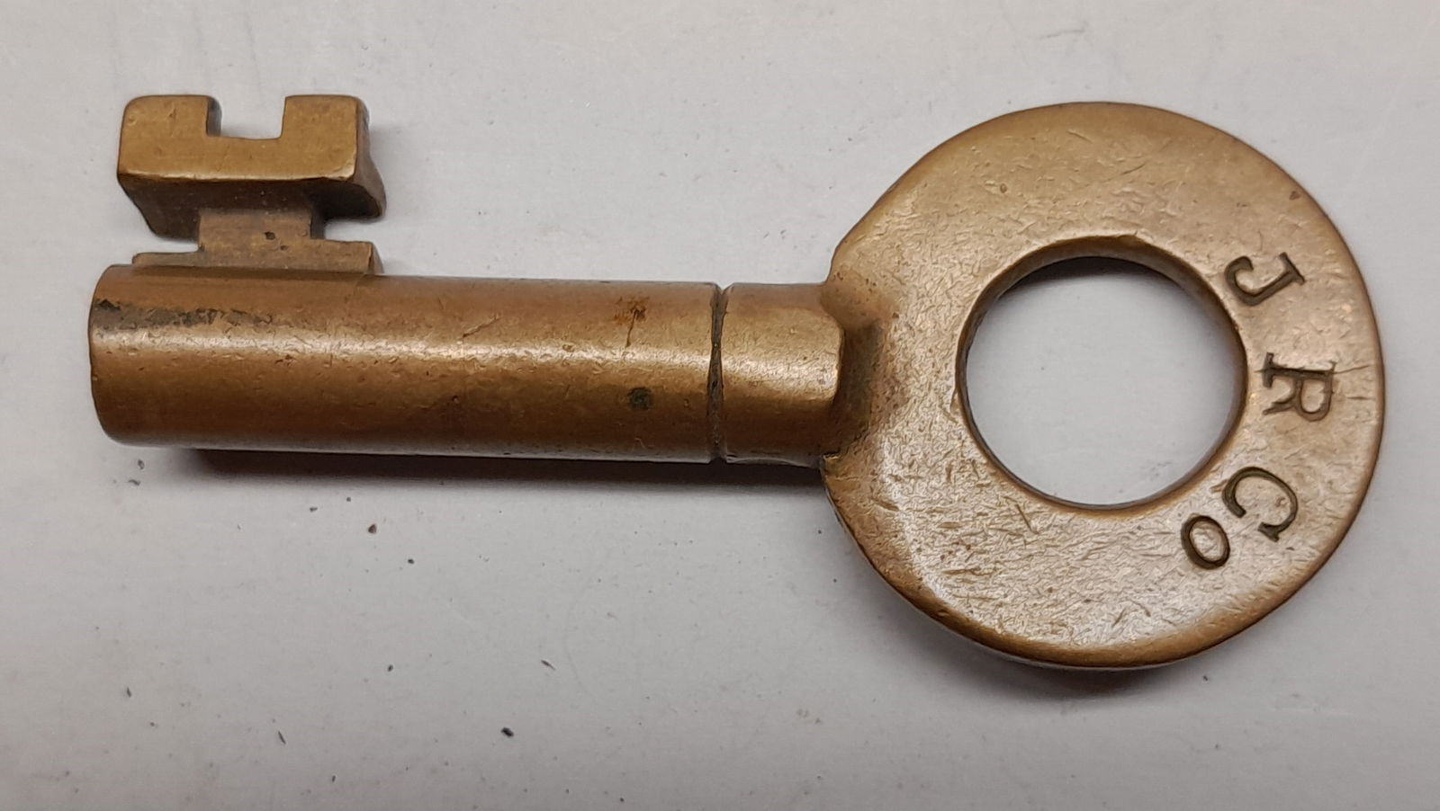 J. R. Co. Brass Switch Style key made by Motley "S" (1 of 2)