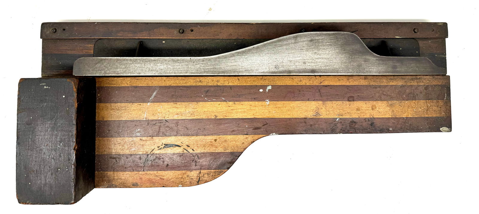 Shooting plane with its matching board: Shooting plane with its matching board; well made by a patternmaker, it features that trade’s use of contrasting strips of wood to give it visual appeal; 24” long, mahogany and maple strips fo
