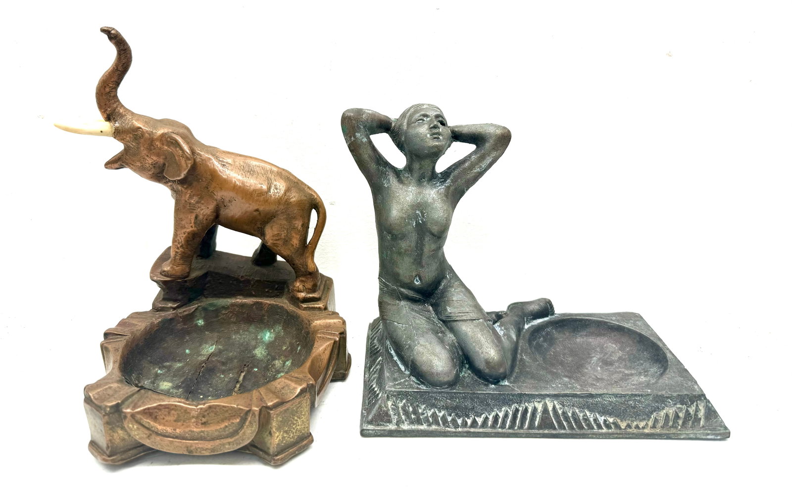 Two Figural Ashtrays: Pot Metal Figural Nude Lady Ashtray Lamp? Signed Dated 1937 Heavy Elephant AsIs Tusks don't appear to be original Cracking to Metal Ashtray. 9"x6"x7"