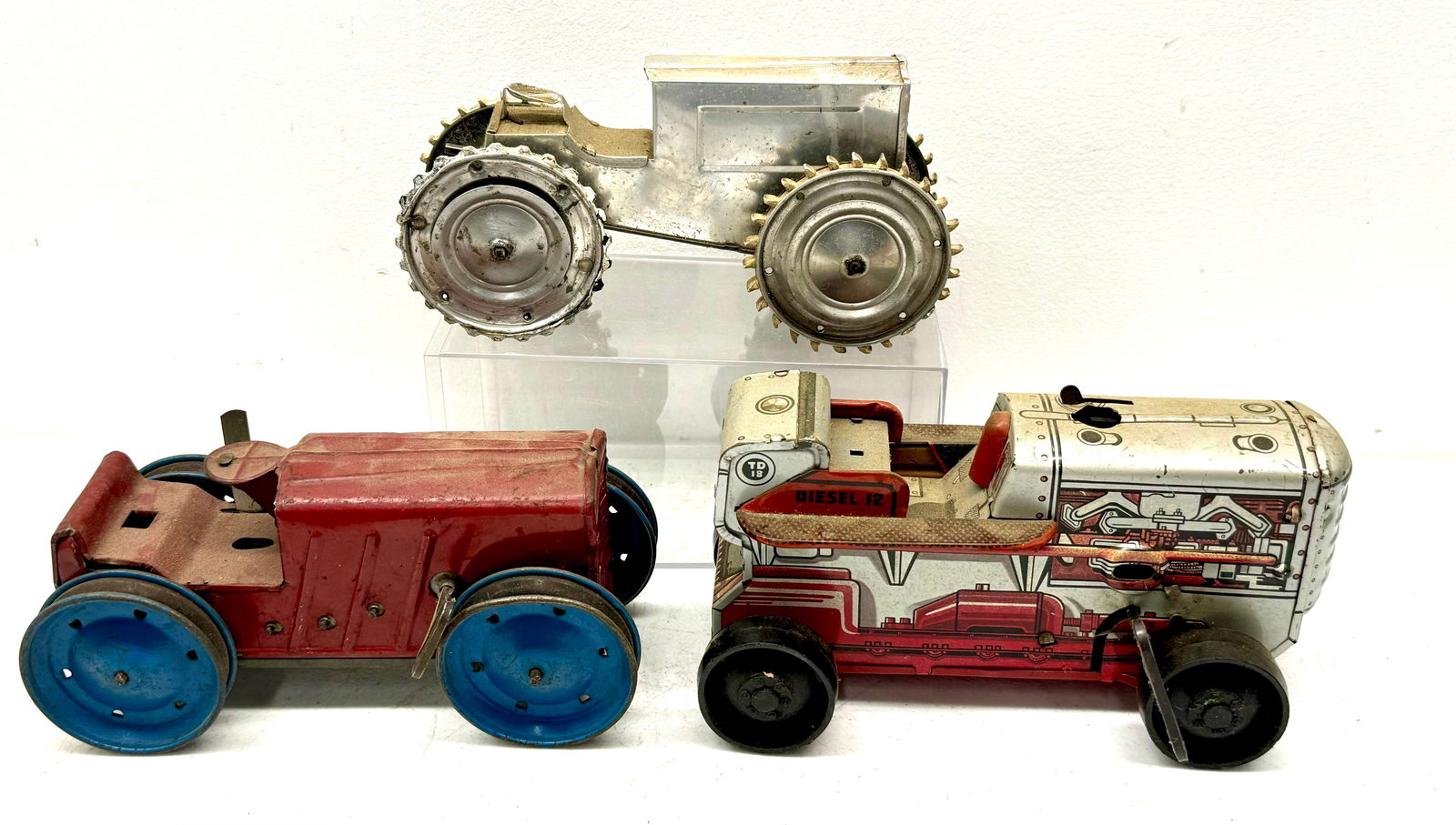 Three Tin Mecahnical Toy Tractors (1 of 5)