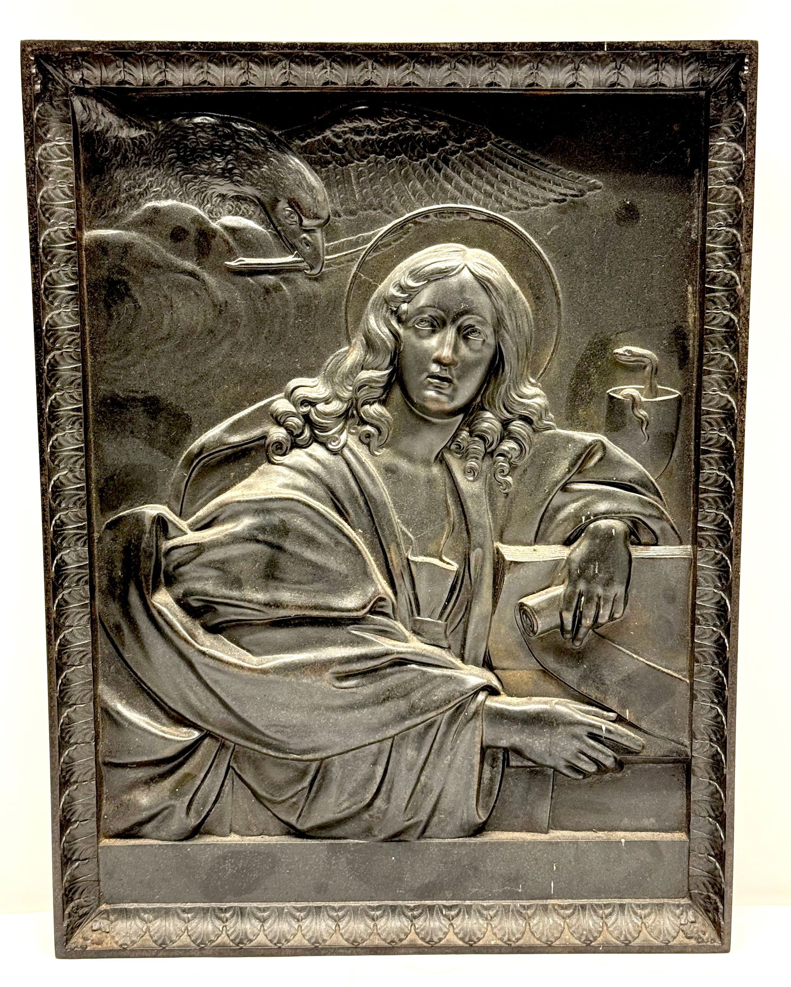 Italian Cast Iron Plaque of St. John The Evangelist: Italian Cast Iron Plaque St. John The Evangelist in relief. Plaque is Very detailed Depicting Seated man With Halo, Eagle Above with Quill Pen, Poisoned Chalice with Snake behind. The Eagle is Represe