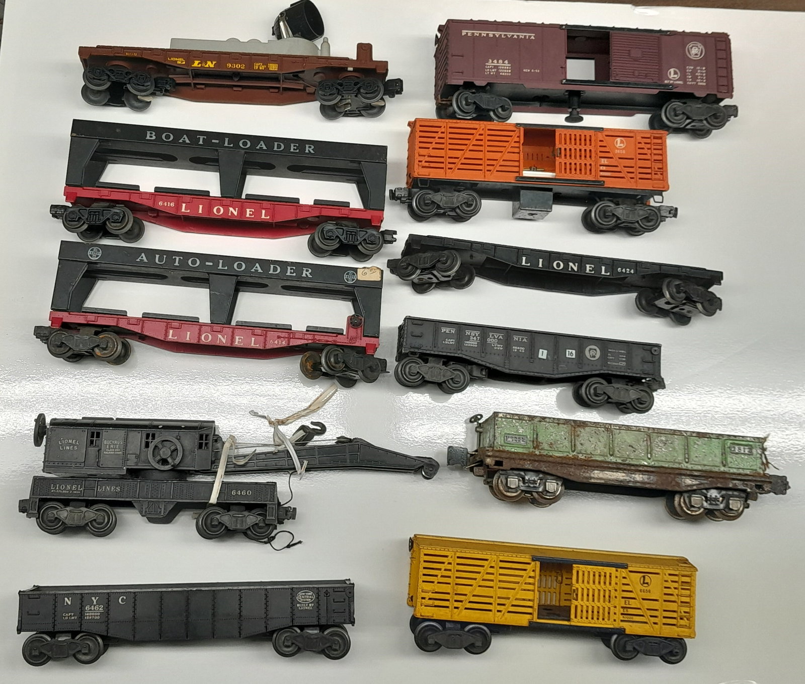 11 Loose Lionel Cars, 6460, 6414, 6415 & more: 11 Loose Lionel Cars, 6460 Crane, 6414, 6415 Boat and Car Loaders, L&N Searchlight and more.