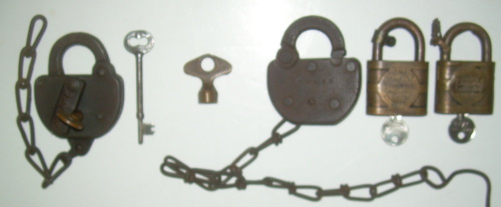 Locks & Keys: Southern, New Haven: This group has a stamped steel lock marked Sout RR ES on the shackle. It has a brass hollow barrel key that is marked Sou. There is also a coach/caboose key marked Sou. The New Haven items include a s