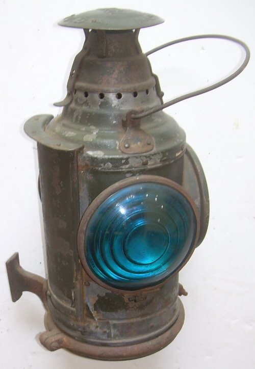 Dressel Marker Lamp (B&MRR tag removed): This lamp had an applied tag that said, "B&M RR". This is a standard B&M lamp and it has it's original green paint. It stands 16" tall. It has 2 blue and one red lenses. It has a pot and burner but th
