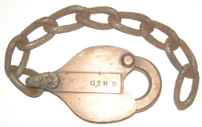 S. C. Thompson Grand Trunk RY Lock: Old Grand Trunk Railway lock made be S. C. Thompson & Co.. The Cadillac of early makers. Nicely marked "GTR S" on the drop. Nice early hand forged chain attached. Excellent condition.