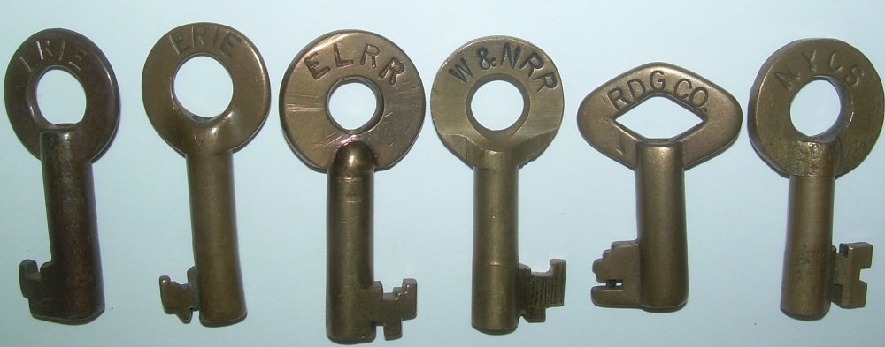 6 Brass Switch Keys: Erie, EL, W&N, RDG, NYC: 6 Brass Switch style keys: 2 Erie and 1 Erie Lackawanna: first is an odd bit, 2nd is standard Fraim switch, 3rd is Adlake standard Erie bit. #4 is "W&N" Wharton & Northern a CNJ affiliate in northern