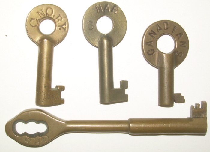 Brass Canadian Keys: CNO, NAR, CPR, Canadians: 4 Canadian Keys: (1) CPR Coach or Caboose key (2) CNO RY looks like an Adams & Westlake but not marked (3) NAR with raised "S" and Mitchell hallmark (4) "Canadians" with "S" 1928 on the reverse. Looks