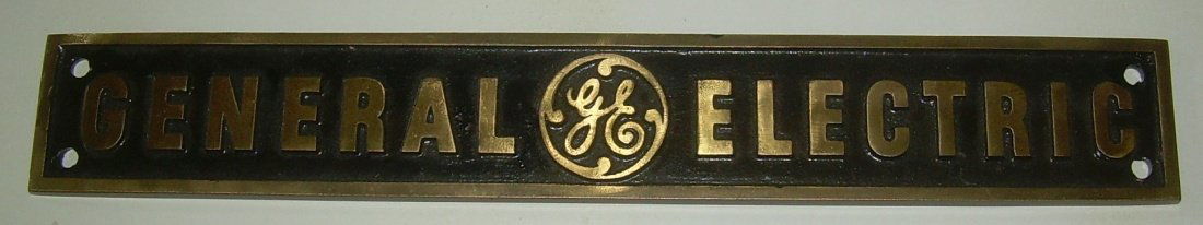 General Electric Brass builder plate: General Electric Brass Builder Plate. Measures 12" by 1 3/4". The reverse has a stamping that might be "845B". Black paint in recesses and polished brass surface. Single black color. No wear to corner
