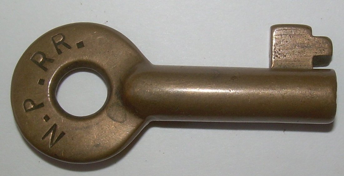 Northern Pacific RR A&W Brass Switch Key: Northern Pacific Railroad - brass switch key with Adams & Westlake early hex style hallmark and "S" for switch. Nice older color.