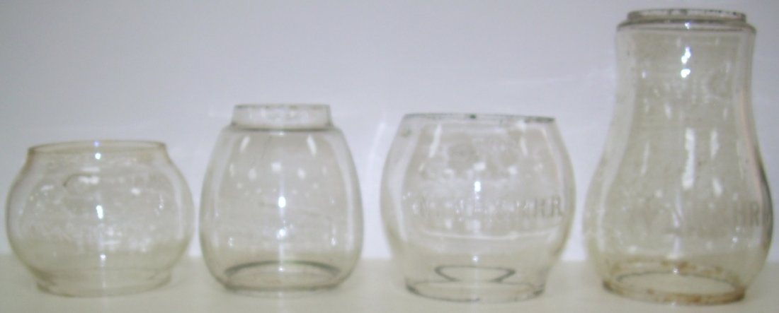 New Haven Railroad Lantern Globes (4): A group of Clear marked New York New Haven & Hartford Railroad globes: (1) Kero size cast NYNH&H in an oval panel - good (2) Vesta size with NYNH&HRR cast in an oval panel - good (3) Kero 100 size (od