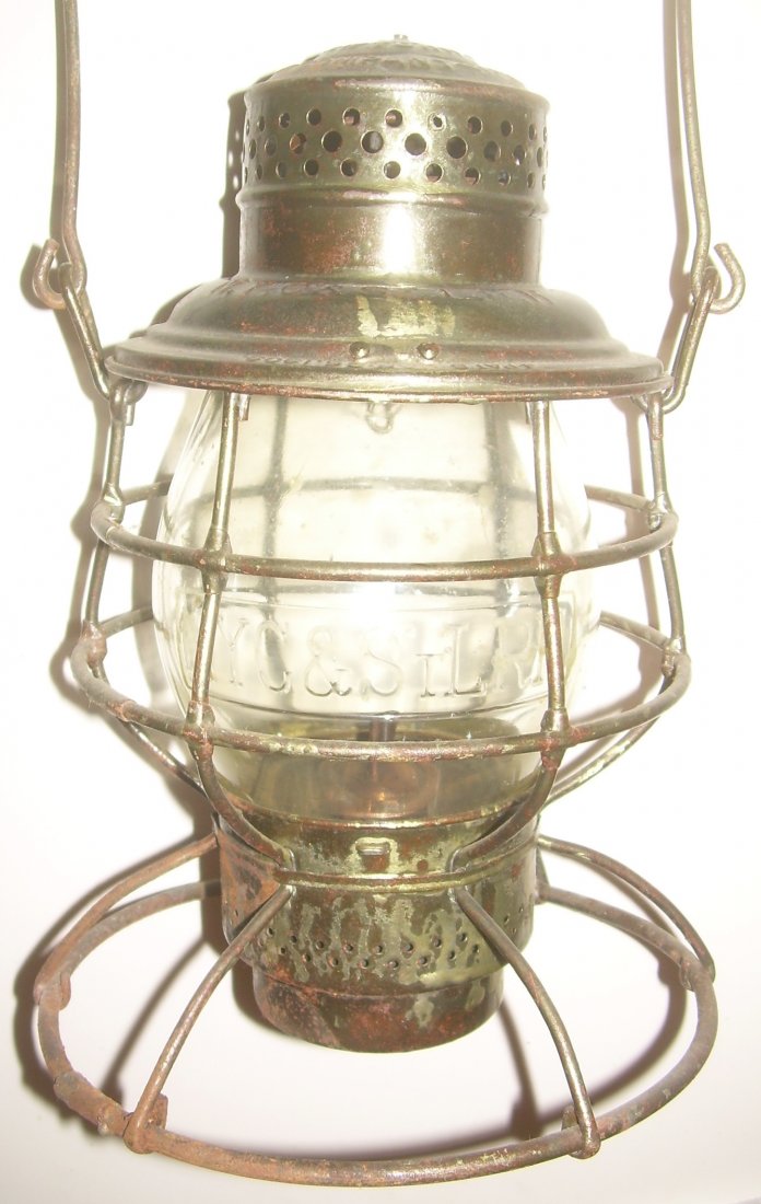 NYC&StLRR A&W Lantern with Cast Globe: Nickel Plate Road (New York Chicago & St Louis) Adams & Westlake with drop in fount. The lid is stamped in the smaller A&W lettering The lantern is complete and all original. The globe has a square en