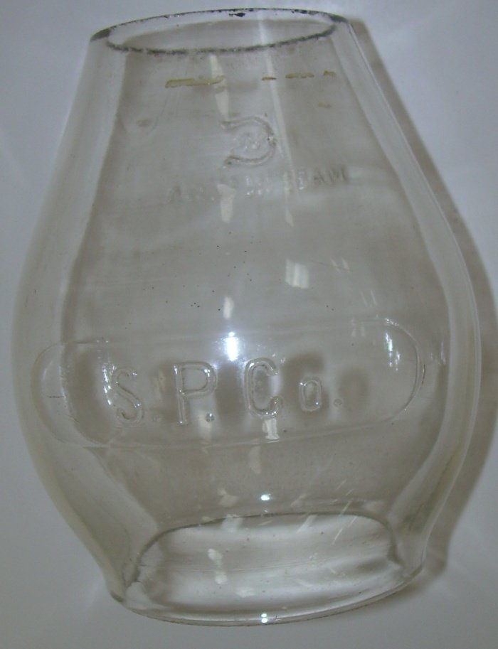 Southern Pacific Co Lantern Globe Cast 5 1/2": SP Co is cast in an oval panel on this standard Corning style tall globe. The casting is good. There is a mold imperfection that looks like a horizontal line near the top. The casting is above average