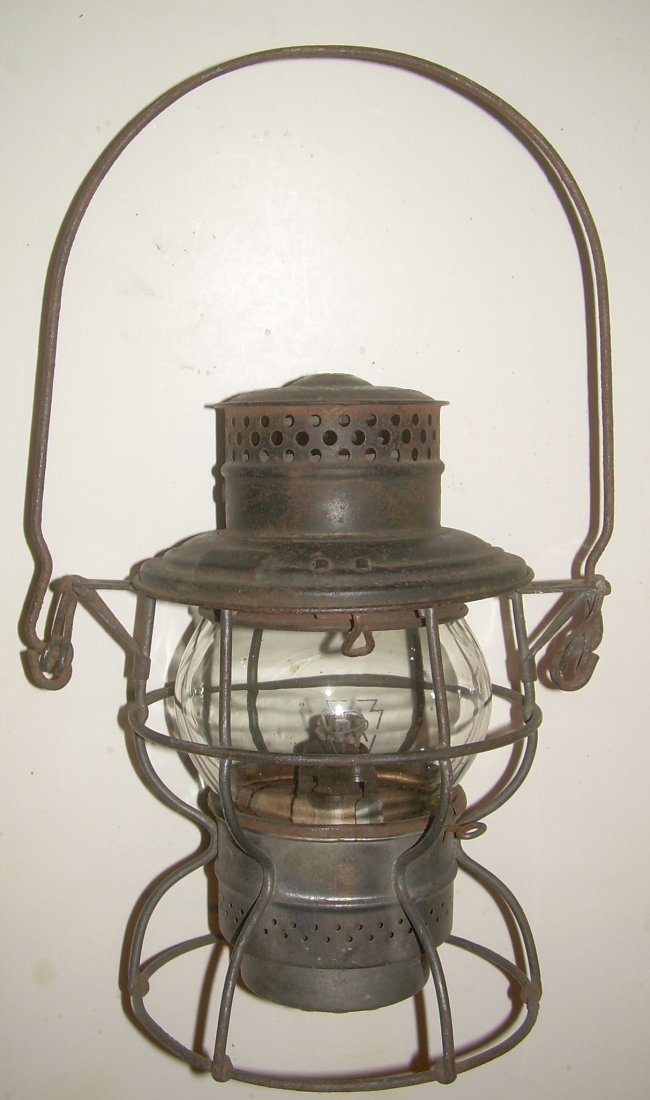Pennsylvania RR Kero Lantern Keystone Etch Globe: Pennsylvania Railroad Keystone logo on the very top of an Adlake Kero #250 lantern. The globe is also etched with the same PRR Keystone logo. The frame has some old green (is that Brunswick?) paint th