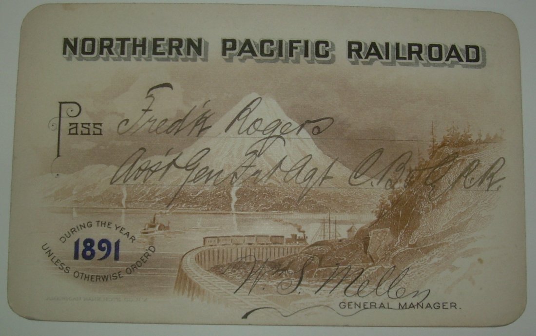 Northern Pacific Railroad – 1891 Pass Vignette: Wonderful snow capped peak vignette with a train and steamboat in the foreground. Fancy and nice.