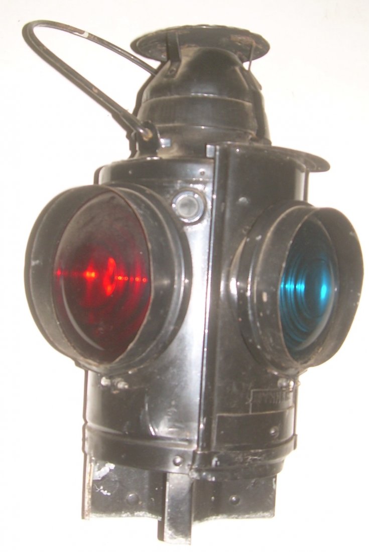 New Haven Handlan Switch Lamp: The Handlan name is clearly stamped on the top plate. The New Haven name is a tag with NYNH&H applied under the lens on the door. All lenses have hoods. The pot and burner are included. There is a min