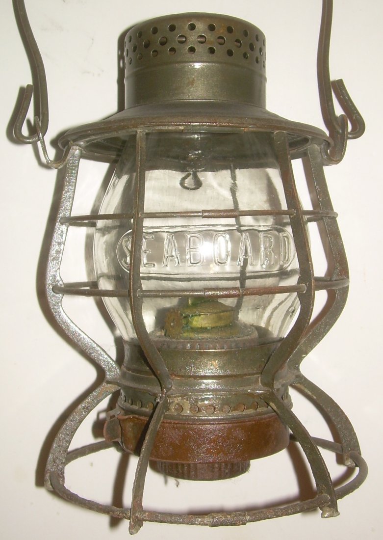 Seaboard Casey Railroad Lantern: Keystone made this "Casey" model with the odd wick raiser that is turned from underneath. The frame is clearly stamped SEABOARD on the lid. The frame shows some light pitting with no other dents or di
