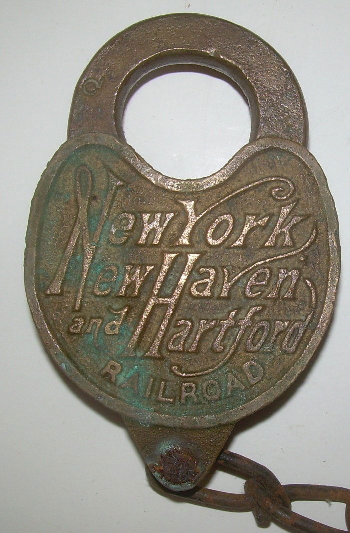 New Haven Cast Back S&E Mfg Brass Lock: New Haven script logo cast panel switch lock. Nice old copper/green tarnish on face. Stamped S&E M Co for Smith and Egge in Philadelphia. A nice uncleaned example with a fine dust cover spring.