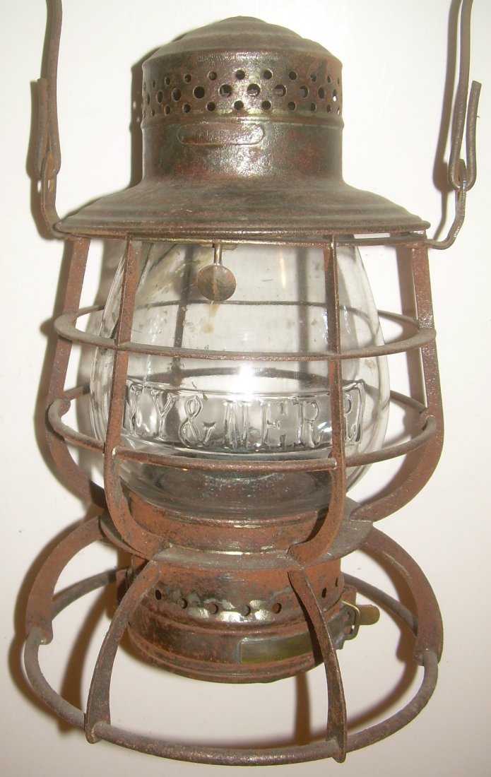 NY&NE RR RR Sig Wire Bottom Lantern: New York & New England pre 1895 Railroad Signal Lamp & Lantern Company frame. 5 3/8 size globe. Wire bottom with a flat vertical and 6 flat verticals. There is a small brass plate on the vent area tha