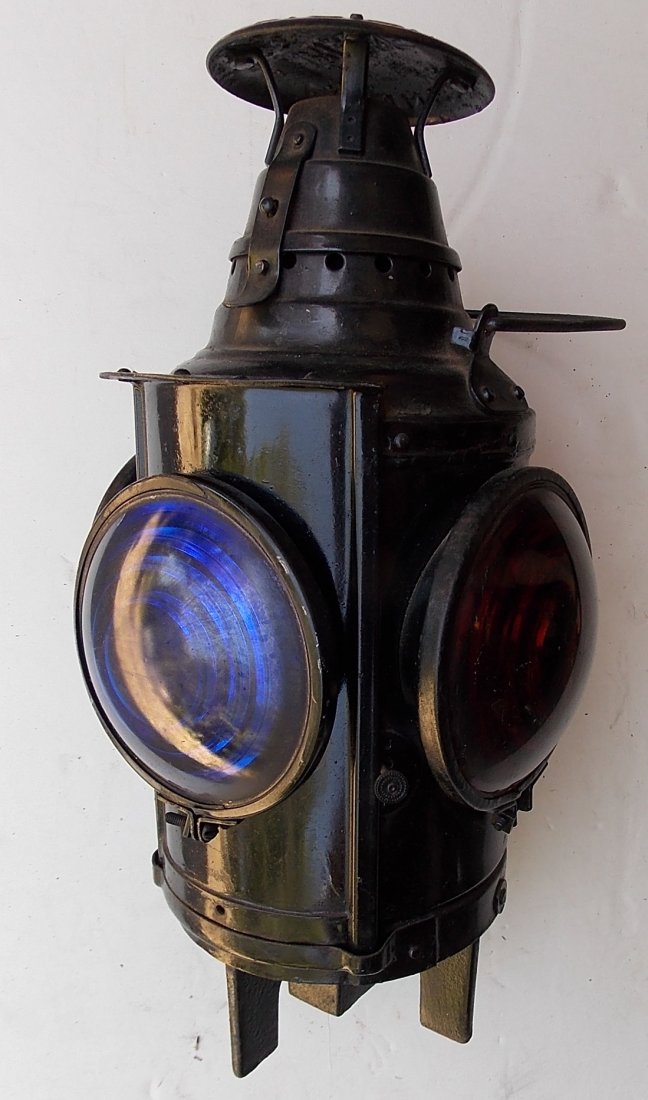 New Haven Dressel Switch Lamp: A Dressel switch lamp made for the New Haven Railroad. It has "NH" cast up in the mounting post. This is next to impossible to photograph. It has blue and amber lenses. It is complete with a pot and b