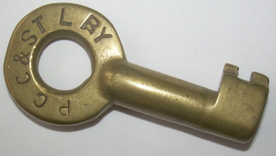PCC&StL RY Brass Switch Key PC Bit: This later era Pennsy/Penn Central key has PCC&StL stamped on the front. It does have an oval Adams & Westlake hallmark on the reverse.