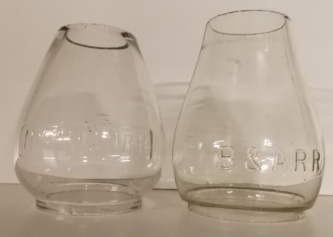 New England Lantern Globes: NYNH&HRR, B&ARR: 2 New England lantern globes: (1) NYNH&HRR strong block lettering cast in a rectangular panel 5 3/8" tall – very nice (2) Boston & Albany Dietz #6 with B&ARR cast in an oval panel