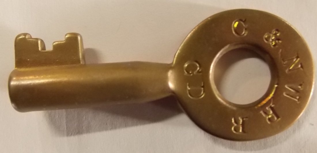 Chicago & North Western Switch Key – Tapered: A larger than normal brass switch key made for the Chicago & Northwestern Railroad. It also has “GD” stamped at 6:00 on the bow. This is probably Galena Division. No maker but there are examples o