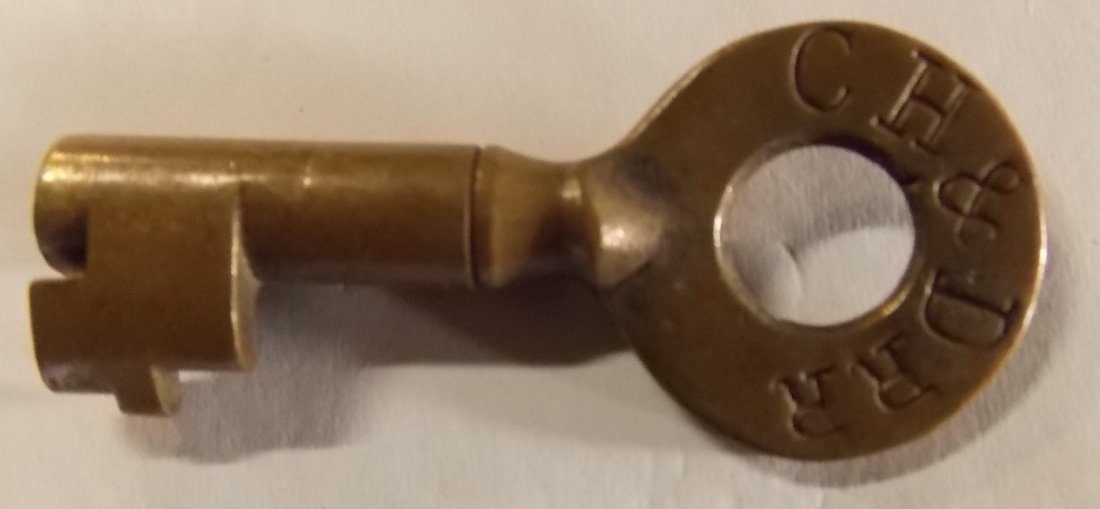 Cincinnati Hamilton & Dayton Railroad Switch Key: A nice larger than average key with a fancy joint at the bow. It's nicely stamped CH&D RR with an additional “S” for Switch use. A nice early key