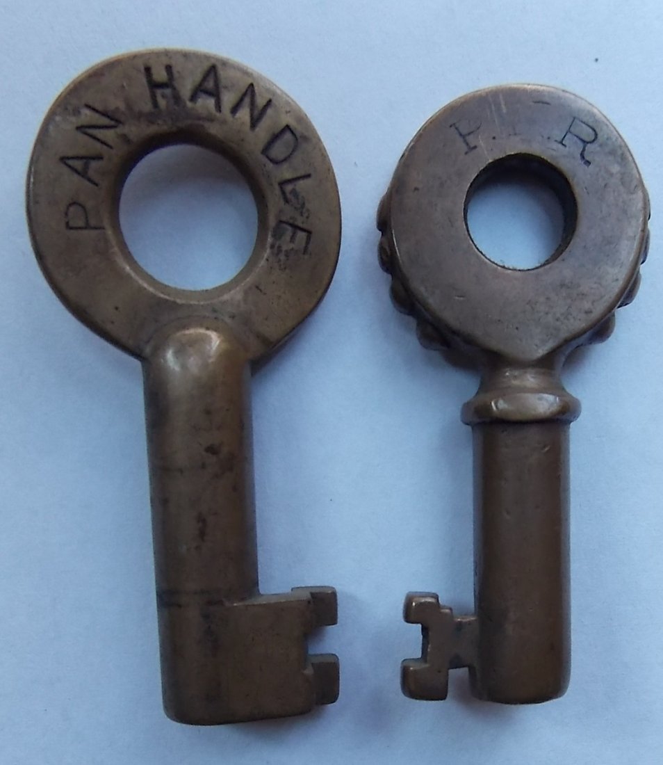 Pennsylvania Railroad Knobby & Pan Handle Keys: A pair of Pennsy keys: (1) Knobby with Fraim “Keystone” hallmark of the reverse and a serial number of “10” (2) Standard PRR switch key marked PAN HANDLE with “S” and “33185” and a hex