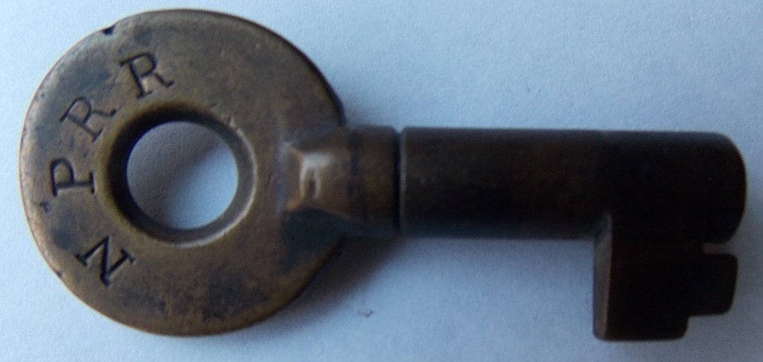 Northern Pacific Railroad Brass Switch Key – ring: A fine ringed barrel husky Bohannan switch key nicely stamped NP RR on the front. It has a standard Bohannan Brooklyn, NY hallmark of the reverse.