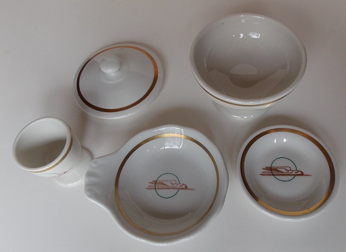 Union Pacific Railroad – 5 Pieces Winged Stream: This group of Union Pacific Railroad “Winged Streamliner” pattern china has: (1) Scammell's single egg cup (2) bob bon dish with slight handle 4” diameter by Sterling (3) butter pat 3 1/4” dia