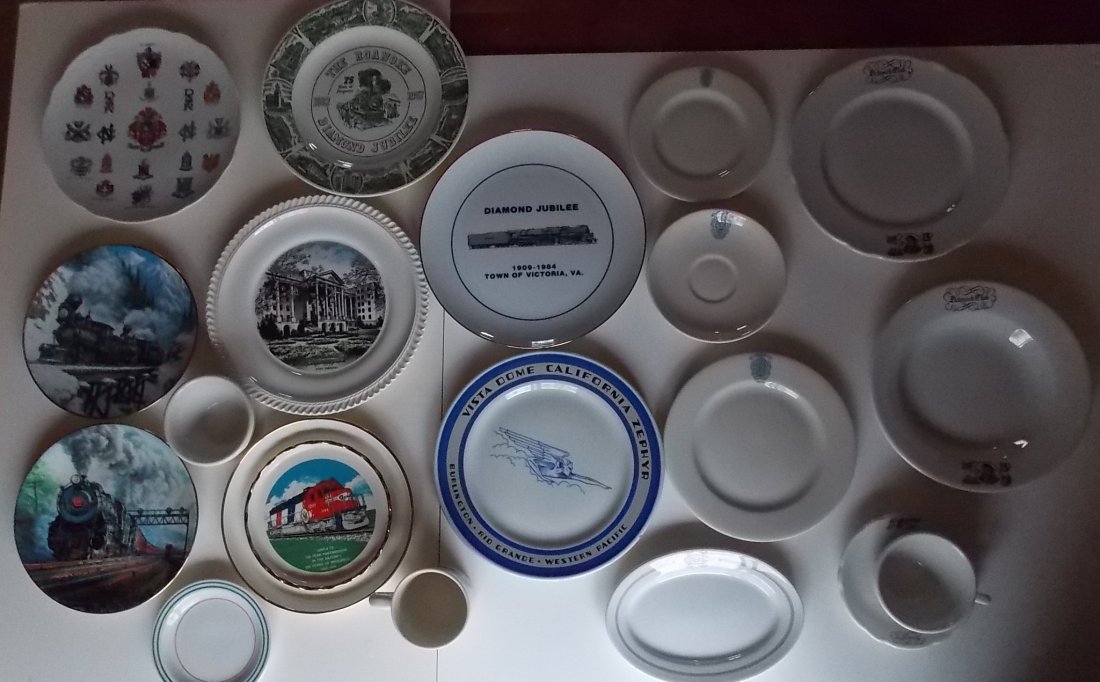 Group of Railroad Related China (16): A large group of Railroad related china. This group includes: Roanoke plate, Greenbrier commemorative plate, Santa Fe commemorative plate, 2 Ted Zaras collector plates, Victoria Virginia Commemorative