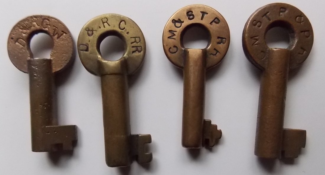 Denver & Rio Grande & Milwaukee Road Switch Keys: 4 Brass switch style keys: D&RGW with “WS” on the reverse. It was made by Slaymaker but not marked by them. WS must be some special purpose. (2) D&RGW RR with “S” and “F5419” and a nice ol