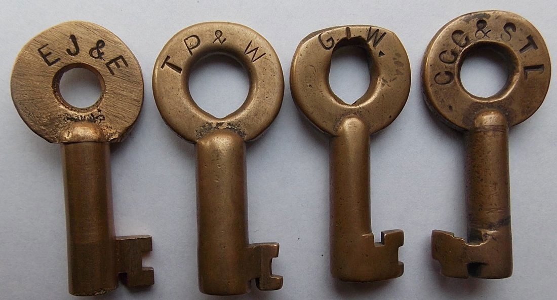 Railroad Switch Keys: EJ&E, TP&W, GTW, CCC&StL: A group of 4 brass switch keys: Elgin Joliet & Eastern “2088” and Adlake on reverse (2) Toledo Peoria & Western - “2026 S” and Adlake on the reverse (3) Grand Trunk Western – Adlake on the r